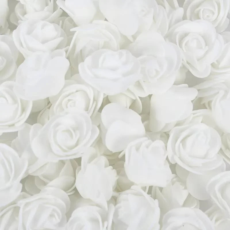 A bulk pack of realistic white foam rose flowers for weddings and events.
