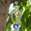 Gold and blue Turkish blue eye amulet horseshoe wall hanging with elephant charm