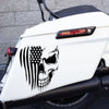 A white motorcycle features a black patriotic skull and American flag decal on the front fender.