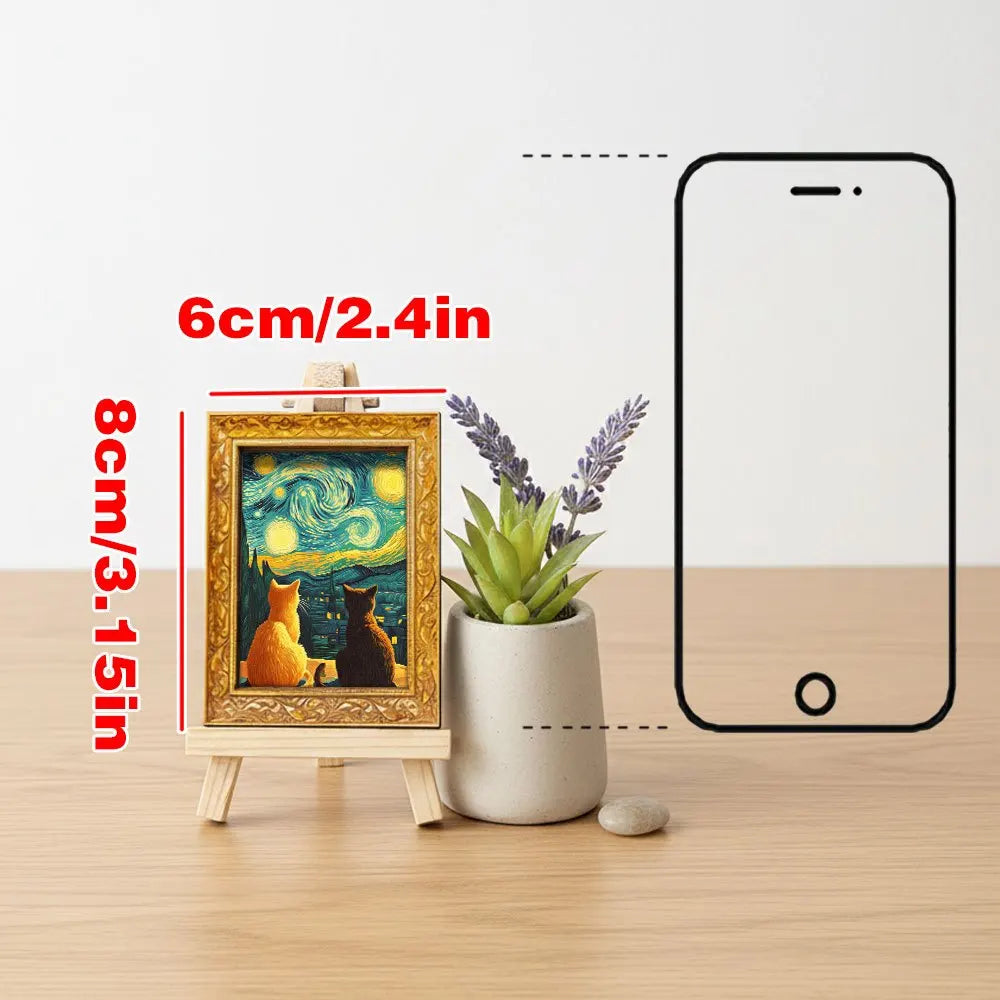 A framed print of a Van Gogh starry sky with cats is displayed next to a smartphone, showing its size.