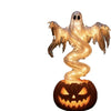 A swirling ghost figure made of glowing light sits atop a carved pumpkin, used as an LED garden lamp for Halloween.