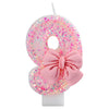 Glitter number cake candle with a pink bow shaped like the number 8 for birthday or anniversary