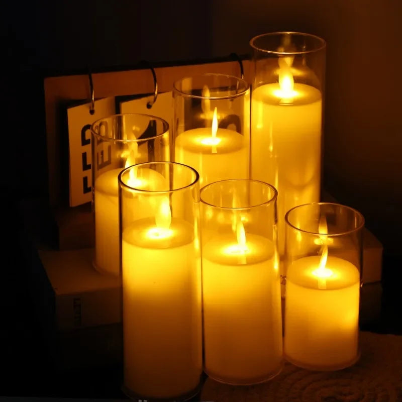 A collection of glowing yellow LED candles in glass holders with flickering flames.