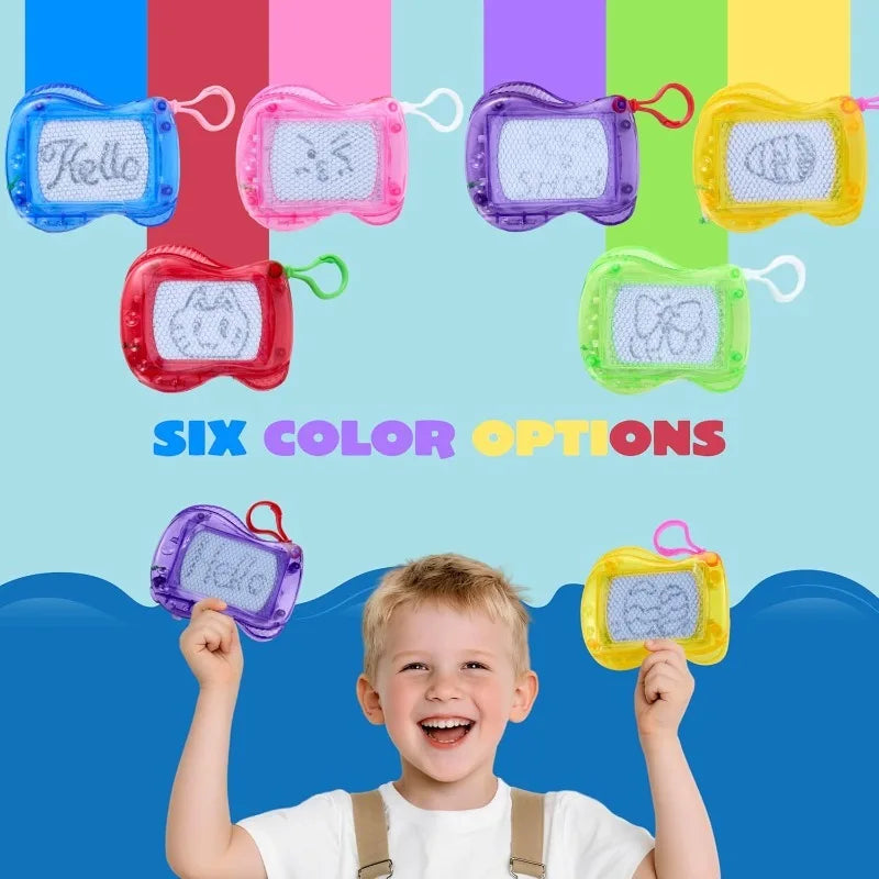 A child is holding a colorful set of six mini magnetic drawing boards with keychains.