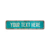 A rectangular, weathered teal aluminum sign with the text YOUR TEXT HERE.