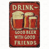 A vintage red metal sign with the text DRINK GOOD BEER WITH GOOD FRIENDS and illustrations of beer mugs.