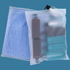 Clear plastic storage bags filled with purple and blue fabric or clothing items