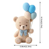 A cute, light brown teddy bear figure with blue and light blue balloon decorations.