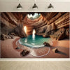 A dramatic interior view of a cave with turquoise water and natural rock formations.
