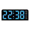A black digital alarm clock displaying 22:38 with a mood light feature.