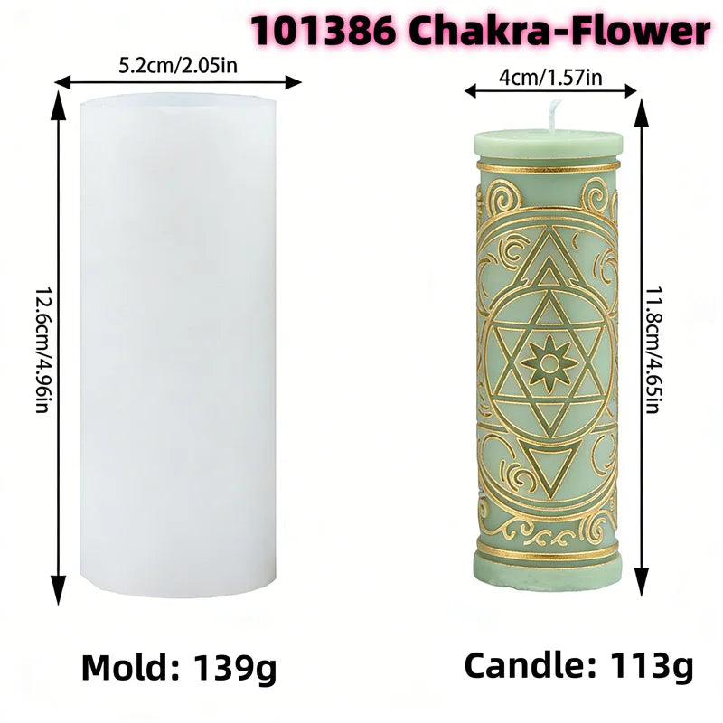A tall pillar candle mold featuring celestial and mystical symbols carved into the wax.