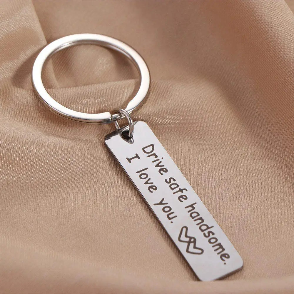 Silver stainless steel keychain engraved with the message I drive safe handsome I love you