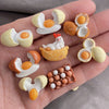 A set of kawaii food-themed fridge magnets featuring various shapes like eggs, a bird, and a loaf of bread.