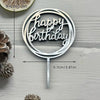 Silver acrylic birthday cake topper with the words Happy Birthday on a stick