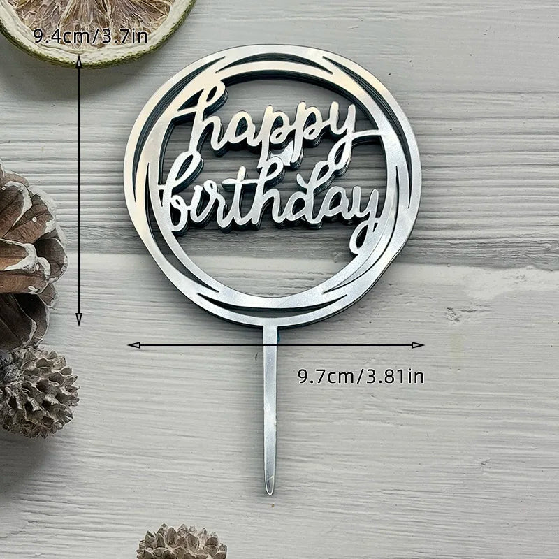 Silver acrylic birthday cake topper with the words Happy Birthday on a stick