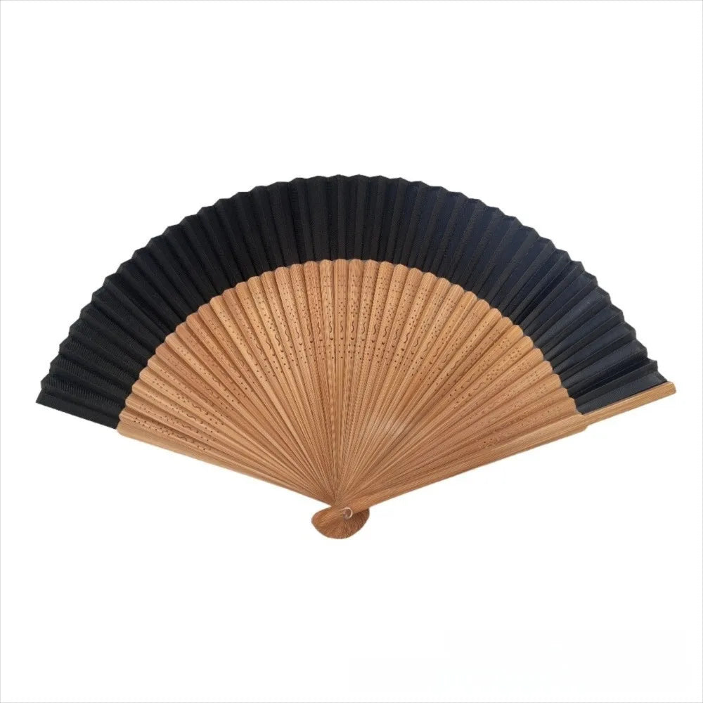 Elegant bamboo folding fan with black and natural wood stripes.
