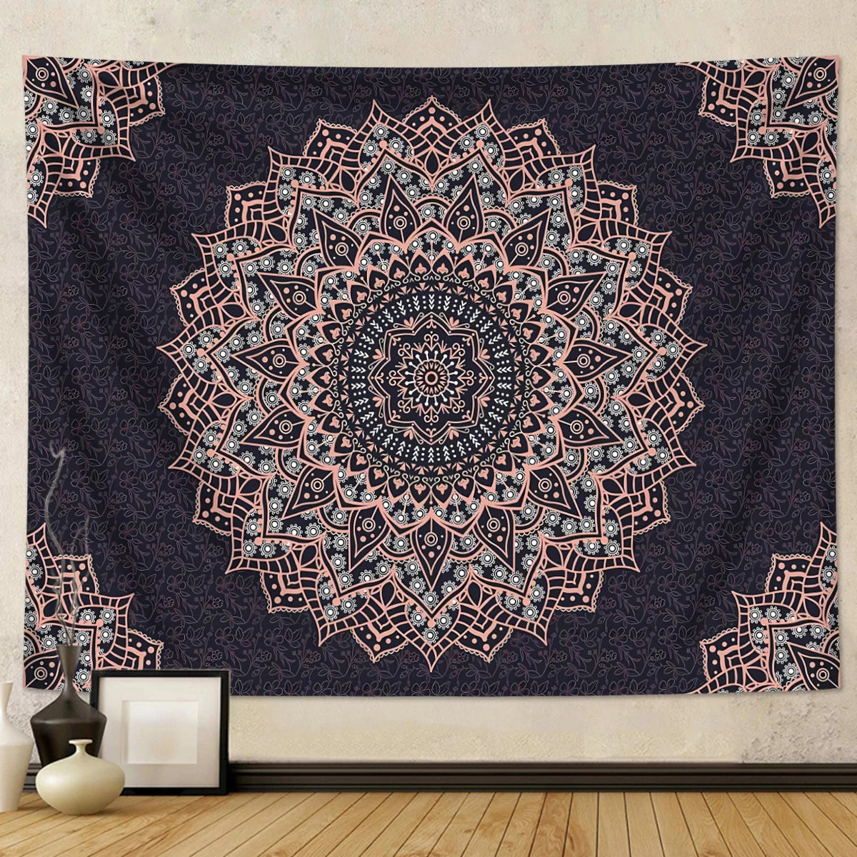 A dark purple bohemian mandala tapestry wall hanging featuring intricate pink and blue geometric patterns.