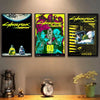 A set of three posters featuring the Cyberpunk Edgerunners theme, displayed on a wall above a wooden surface.