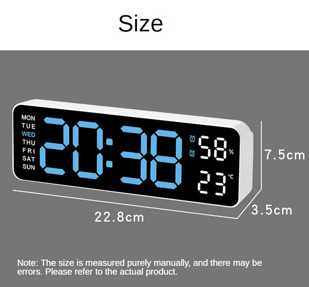 A digital wall clock displaying the time 20:38, temperature 23°C, and showing various days of the week.