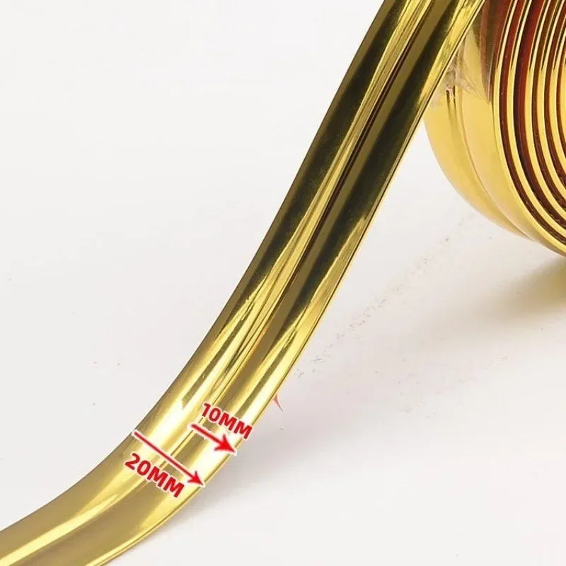 A close-up of a gold-colored self-adhesive PVC edge guard strip showing measurements of 10mm and 20mm.
