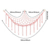 A pink cotton corner toy hammock for stuffed animals and plushies with hanging strands.