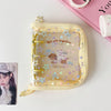 A yellow glitter star card binder with a clear window showing a small dog and a cat, set off together.