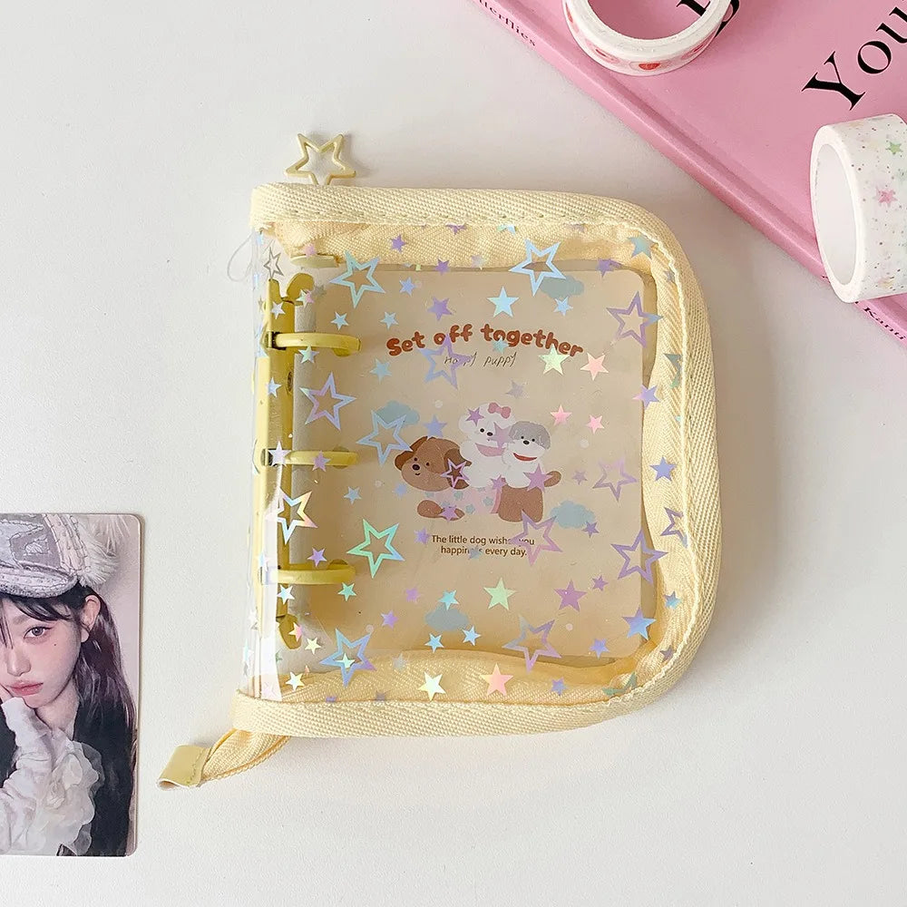 A yellow glitter star card binder with a clear window showing a small dog and a cat, set off together.