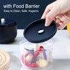 A hand is placing a black food barrier lid onto a clear container filled with chili peppers and garlic for a mini electric fo