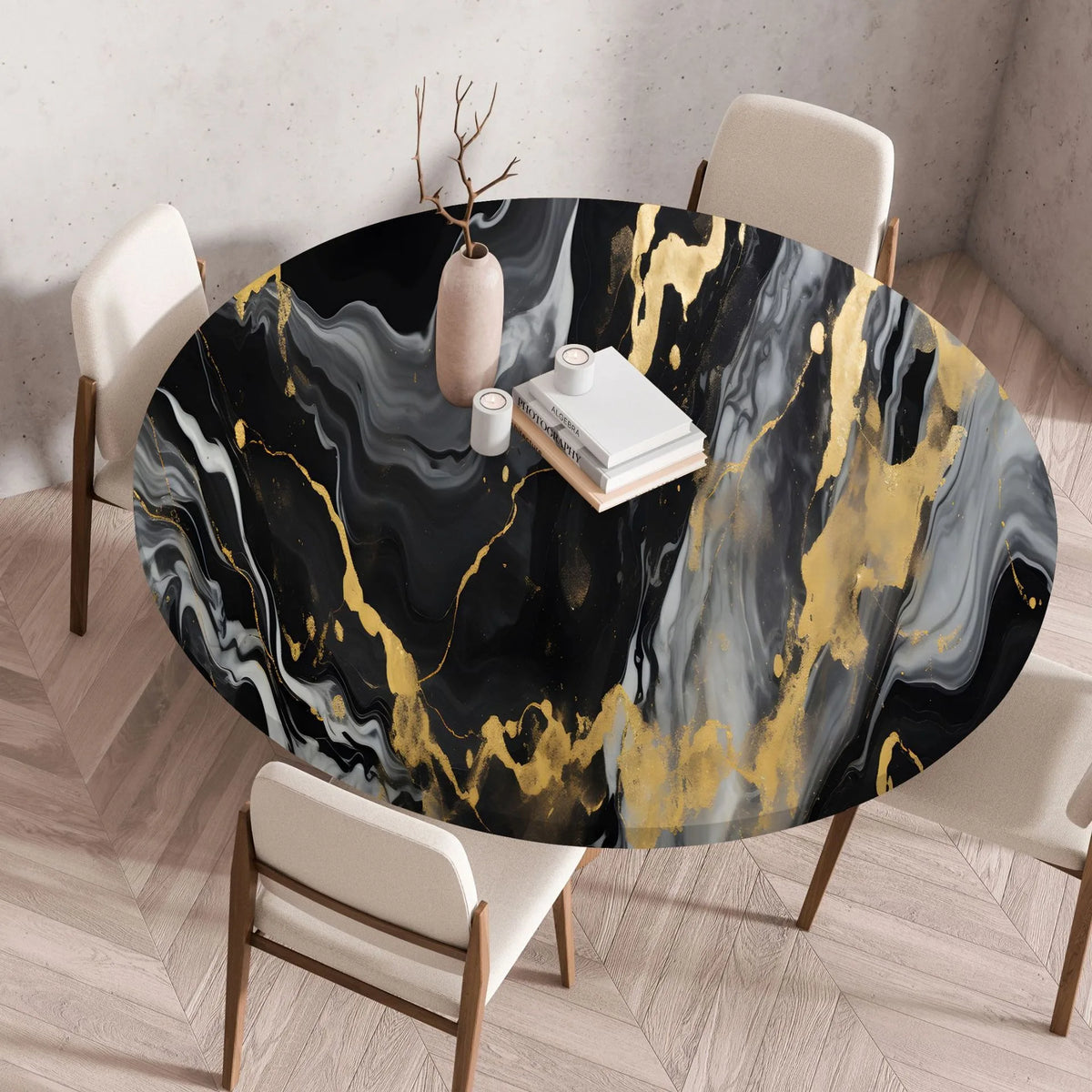 A round table set for dining featuring a black and gold marble print tablecloth on a wooden table.