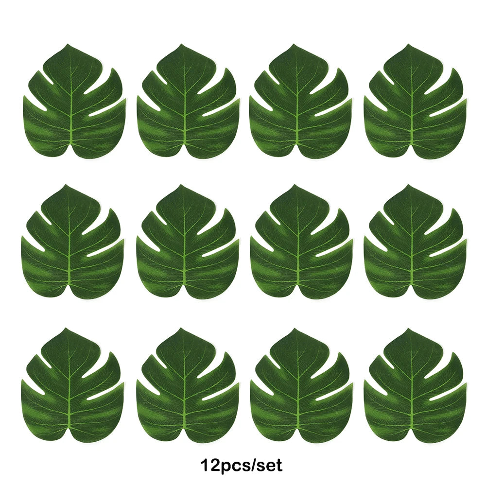 A set of twelve artificial tropical palm leaves in various shades of green for party decor.