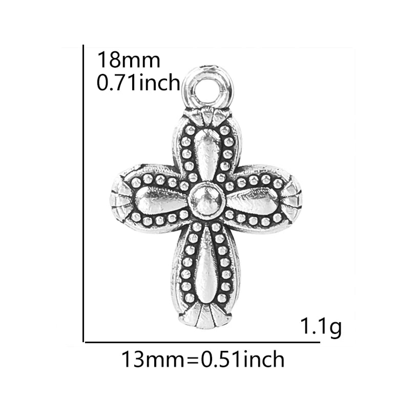Antique silver cross charm measuring 18mm long and weighing 1.1 grams