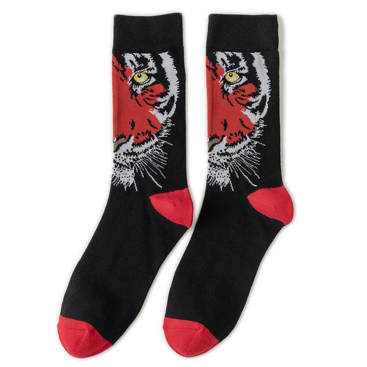 A pair of black crew socks featuring a tiger print with red accents.