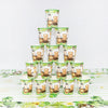 A set of green and brown patterned cups for a jungle safari birthday party table.