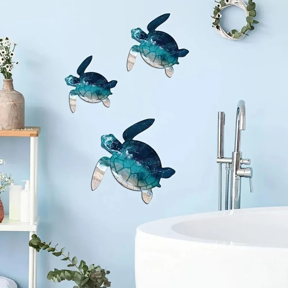 A teal and blue iron wall art sculpture of a sea turtle hanging on a light blue wall above a sink.