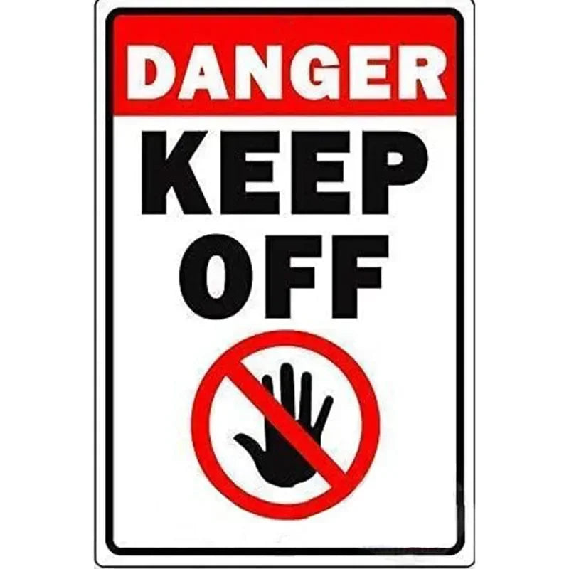 A vintage red and white sign warning to keep off, featuring a hand symbol.
