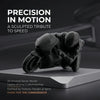 A dark, sculpted figurine of a racing motorcycle rider made from 3D printed material on a gray desk.