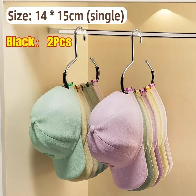 Black round multi-purpose closet hooks displaying various colored hats and bags on a hanger