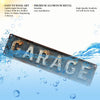 A rectangular vintage garage metal sign made of aluminum with distressed lettering floating in blue water.