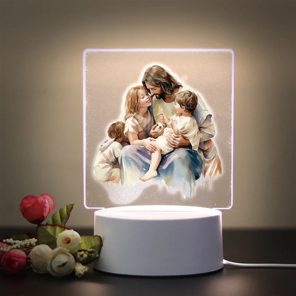 A 3D LED night light featuring a depiction of Jesus holding children, illuminated with a soft glow.