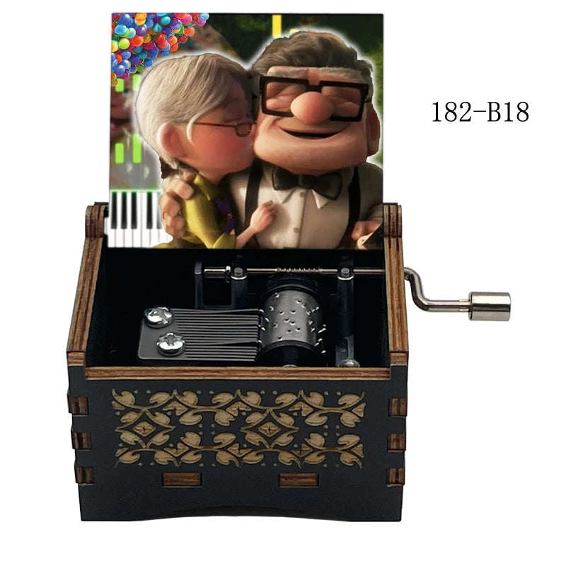 A wooden music box featuring a figurine of a man and woman, with a crank mechanism visible.