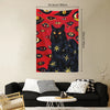 A dark tapestry wall hanging featuring a black cat with glowing yellow eyes against a red background.