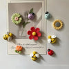 A set of ten reusable fridge magnets featuring floral and insect designs in various colors like green, pink, yellow, and oran