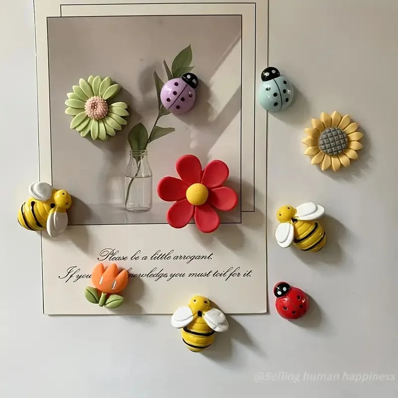 A set of ten reusable fridge magnets featuring floral and insect designs in various colors like green, pink, yellow, and oran