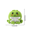 Handmade crochet positive octopus doll in lime green with a slogan pocket