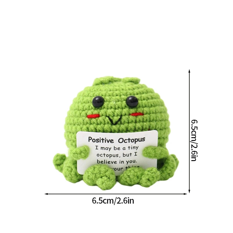 Handmade crochet positive octopus doll in lime green with a slogan pocket