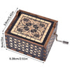 Antique engraved wooden music box with intricate geometric patterns and decorative carvings