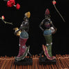 Hand-painted resin statue of an African tribal lady with intricate detailing and colorful clothing.