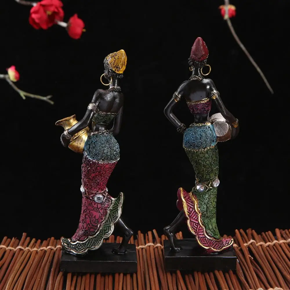 Hand-painted resin statue of an African tribal lady with intricate detailing and colorful clothing.