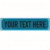 A rectangular teal metal sign with the text YOUR TEXT HERE in white capital letters.