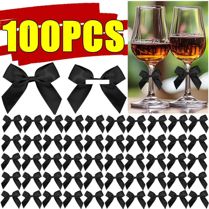 A collection of black satin ribbon bows with self-adhesive backing shown in various sizes and patterns.